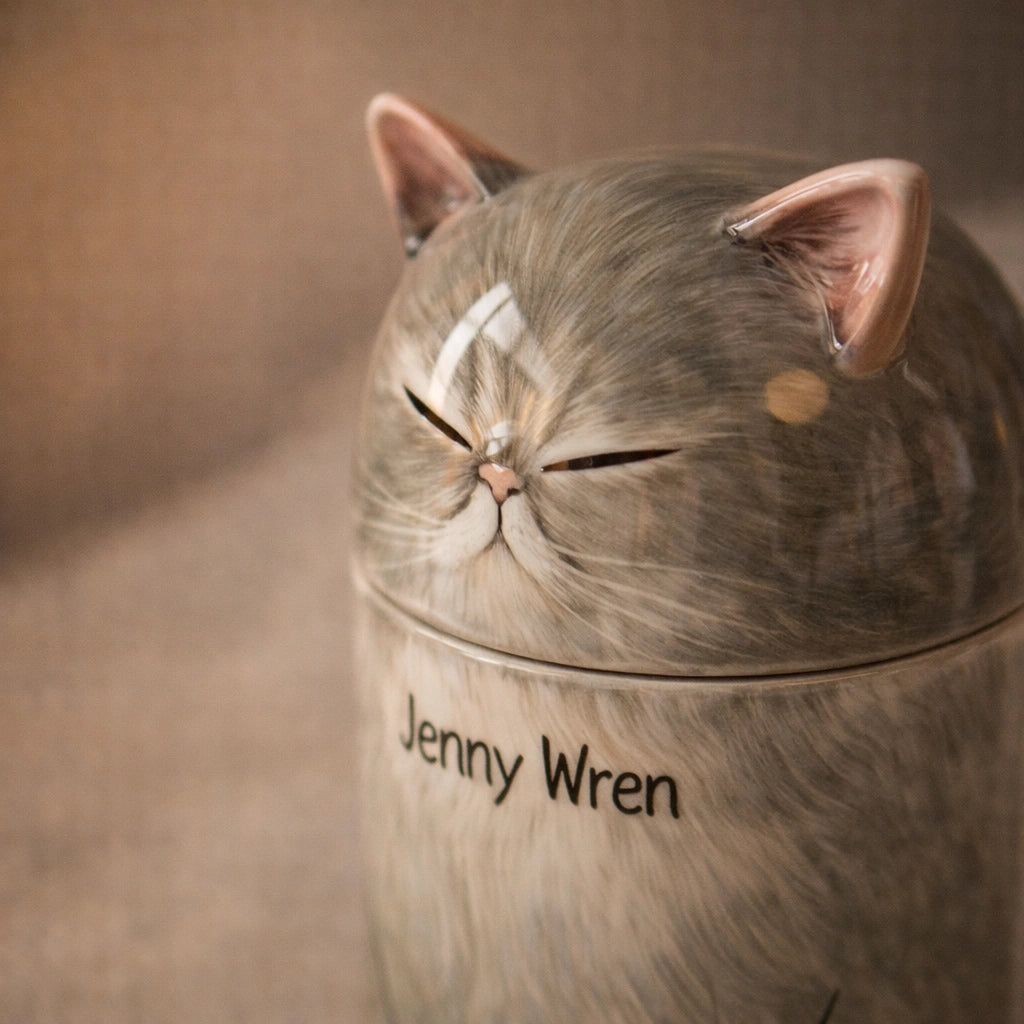 Ceramic cat urn designed for quiet indoor environments