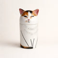 Personalized ceramic cat urn with calm half-closed eyes on white background