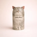 Personalized ceramic cat urn with closed eyes and soft gray glaze