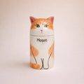 Personalized ceramic cat urn with open eyes and orange white glaze