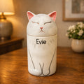 Personalized ceramic cat urn with closed eyes and soft white glaze