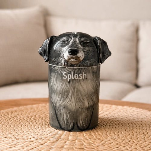 Personalized ceramic dog urn with closed eyes and dark surface tone