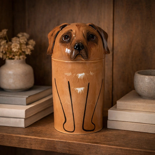 Minimal ceramic dog memorial urn photographed in soft natural light