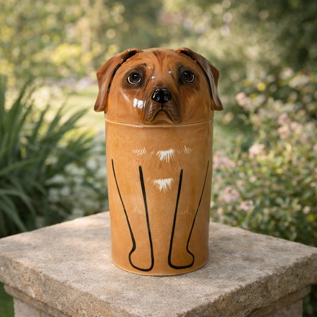 Warm-toned ceramic dog urn displayed on light textured surface