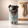 Personalized ceramic dog urn with illustrated blue garment design
