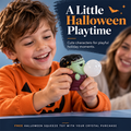 Child squeezing a green Halloween monster toy with a bubble expanding from its mouth