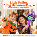 Children showing a pumpkin inflatable wristband and a purple witch balloon wand in Halloween costumes